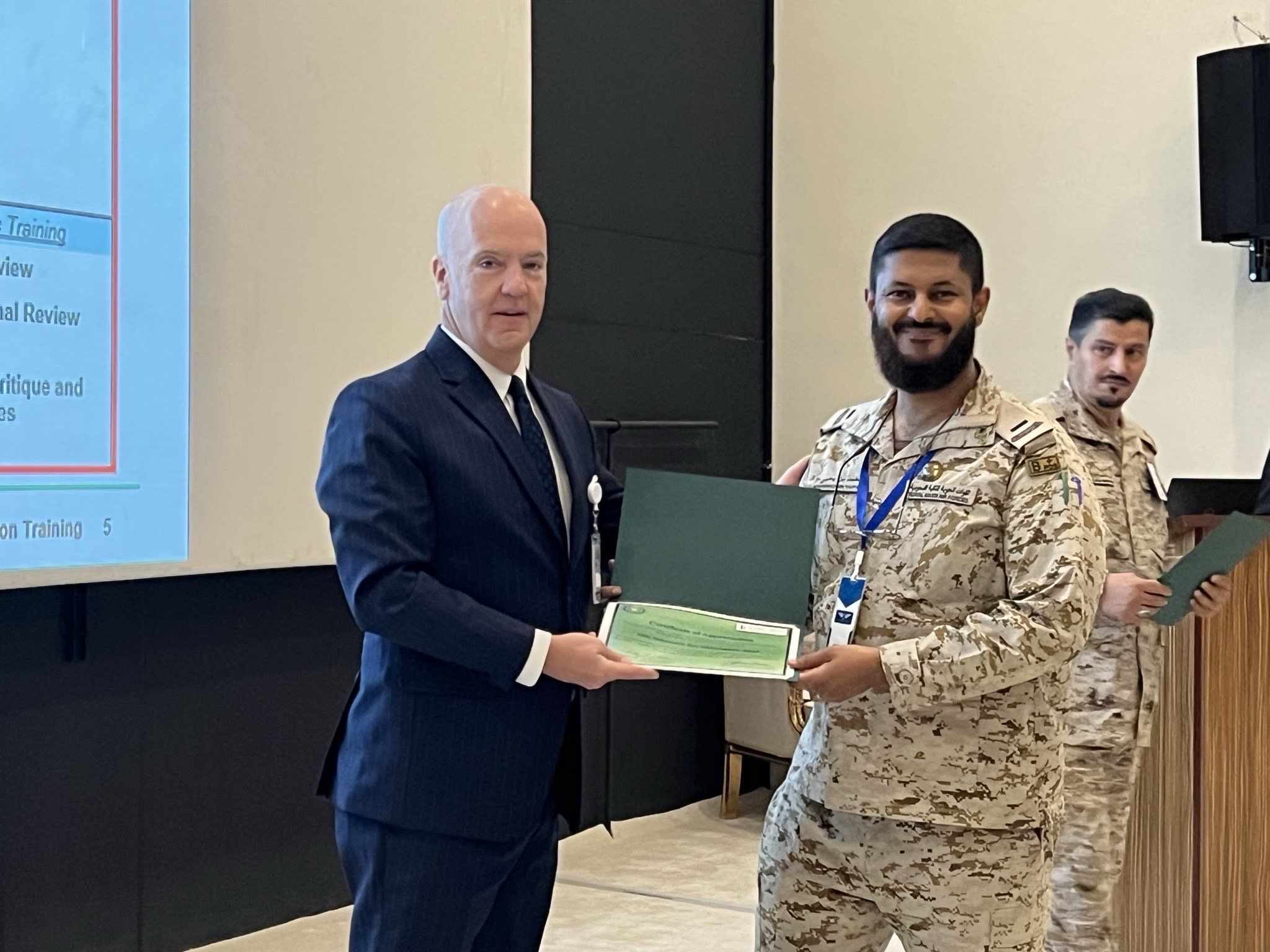 General Davis presenting a training certificate